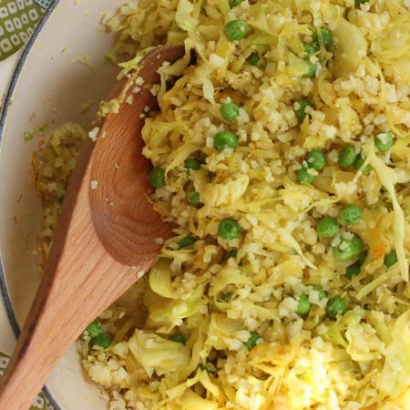 Super simple Indian inspired cabbage stir fry recipe with cauliflower rice and peas. Gluten free, low carb and delicious!